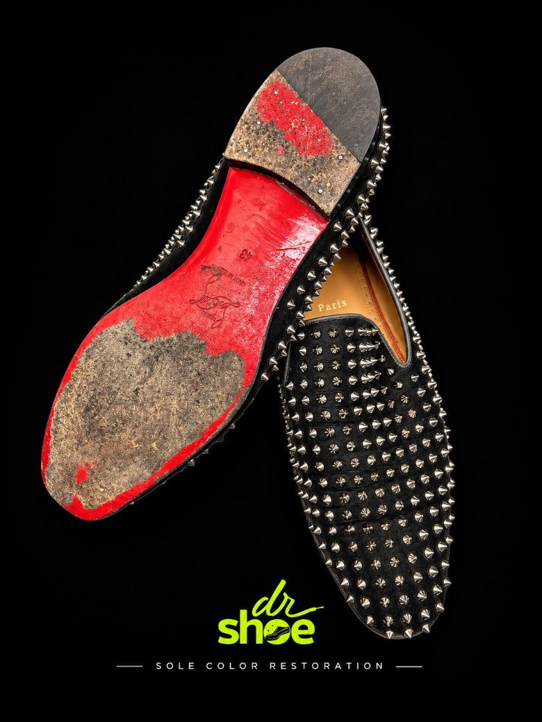 A Louboutin heel with its red sole scuffed away to bare material