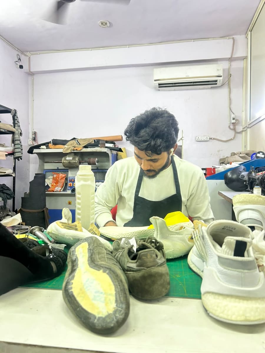 Trainees sorting uppers by material at the Dr Shoe workshop